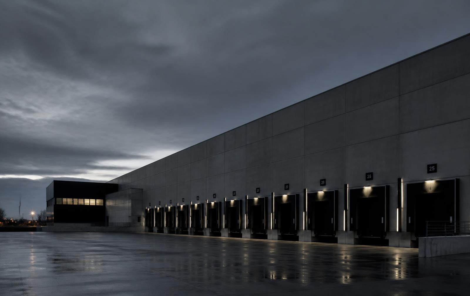 European distribution facility exterior at dusk